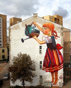 A mural of a girl watering a plant